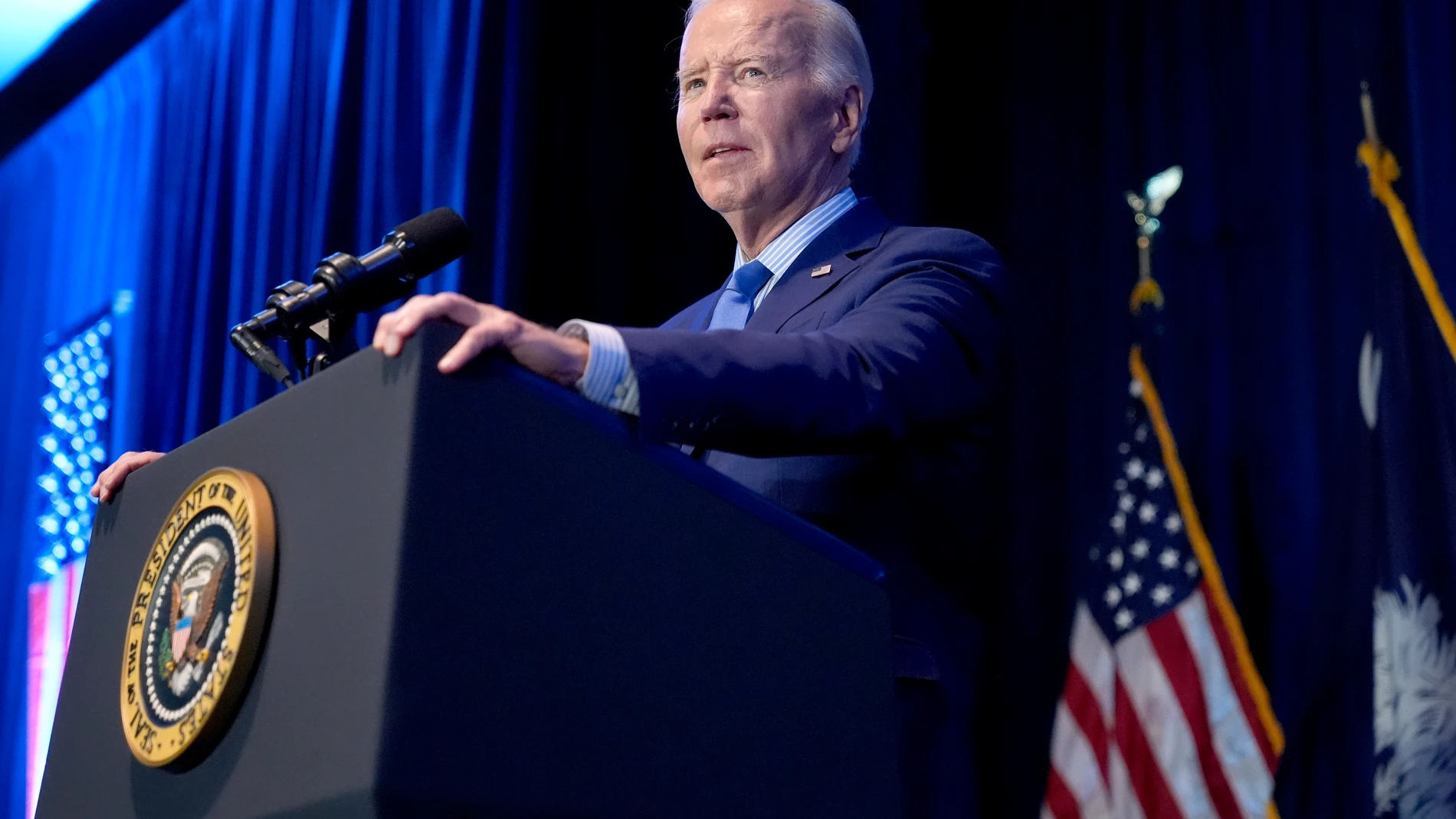 FILE - President Joe Biden speaks at South Carolina's First in the Nation dinner at the South Carolina State Fairgrounds in Columbia, S.C., Jan. 27, 2024. The Biden administration will start implementing a new requirement that the developers of major artificial intelligence systems disclose their safety test results to the government. (AP Photo/Jacquelyn Martin, File)