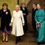 Britain's Queen Camilla arrives and is escorted as she attends a Musical Evening at Salisbury Cathedral, Salisbury, England, Thursday, Feb. 8, 2024, to celebrate the work of local charities. (AP Photo/Kirsty Wigglesworth, Pool)