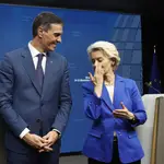 Spain's Prime Minister Pedro Sanchez and European Commission President Ursula von der Leyen pose at a media conference at the conclusion of a European Union summit in Brussels.