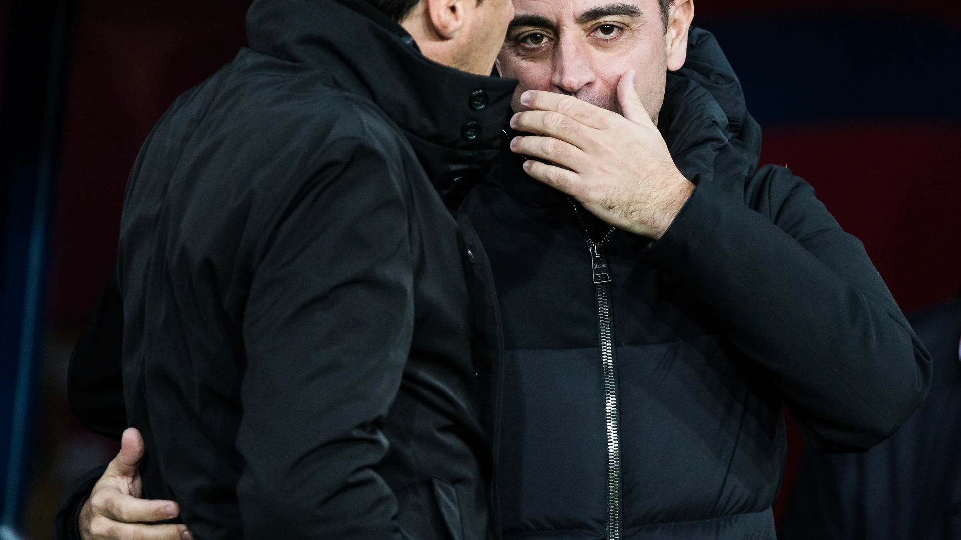 Xavi Hernandez, head coach of FC Barcelona, saludates to Alexander Medina Head coach of Granada CF during the Spanish league, La Liga EA Sports, football match played between FC Barcelona and Granada CF at Estadio Olimpico de Montjuic on February 11, 2024 in Barcelona, Spain. AFP7 11/02/2024 ONLY FOR USE IN SPAIN