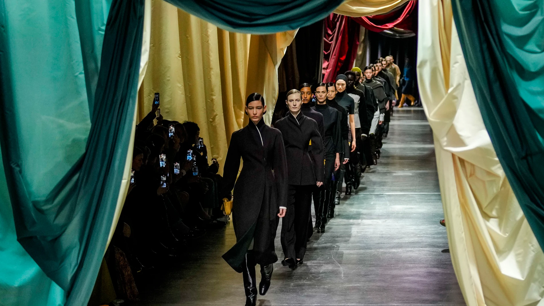 Models wear creations during the Fendi women's Fall-Winter 2024-25 collection presented in Milan, northern Italy, Wednesday, Feb. 21, 2024. (AP Photo/Antonio Calanni)