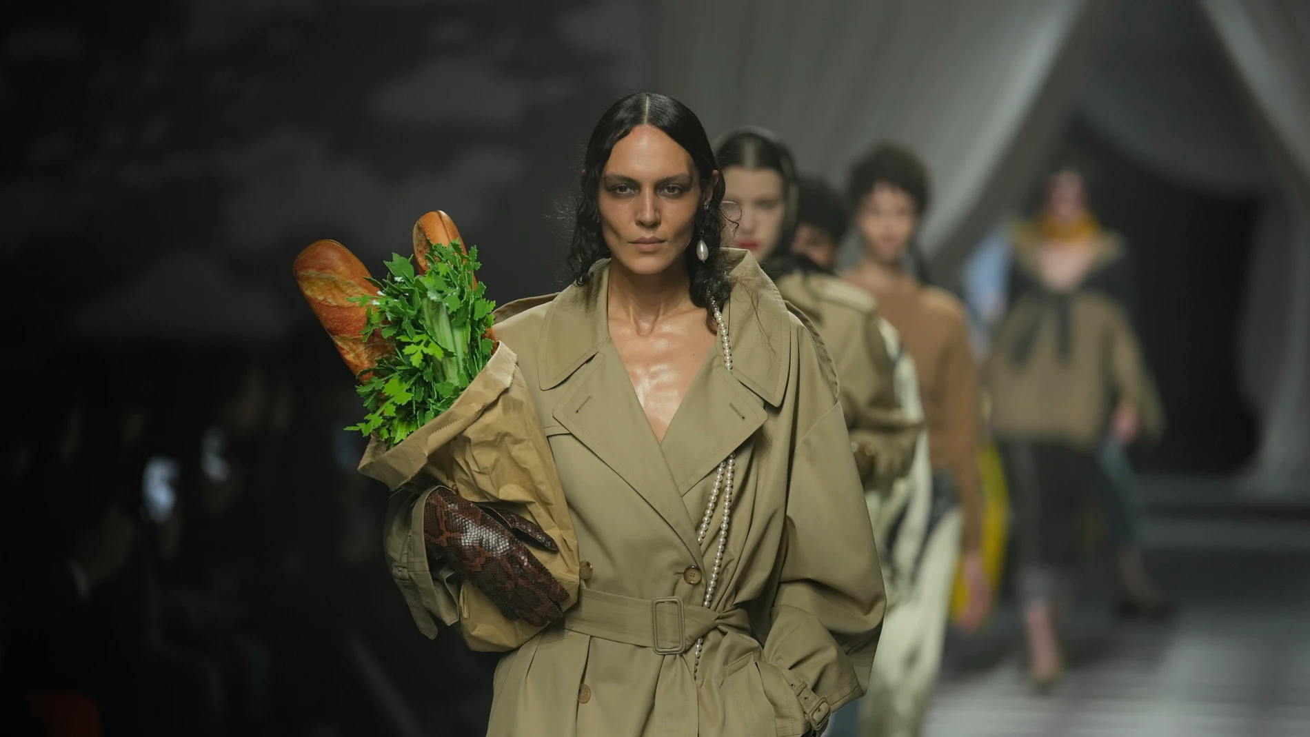 Models wear creations as part of the Moschino women's Fall-Winter 2024-25 collection presented in Milan, northern Italy, Thursday, Feb. 22, 2024. (AP Photo/Antonio Calanni)