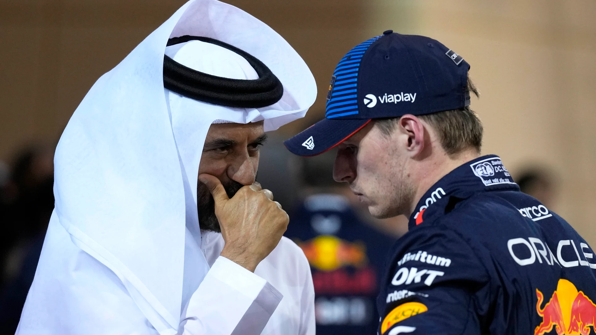 Red Bull driver Max Verstappen of the Netherlands, center, who qualified for pole position, speaks with FIA President Mohammed Ben Sulayem after qualification ahead of the Formula One Bahrain Grand Prix at the Bahrain International Circuit in Sakhir, Bahrain, Friday, March 1, 2024. (AP Photo/Darko Bandic)