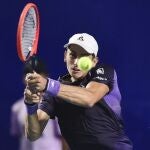 Italy's Matteo Arnaldi hits a return against USA's Taylor Fritz during the Mexico ATP Open 500 men's round of 32 tennis match at Arena GNP Seguros in Acapulco, Guerrero , Mexico on February 26, 2024.