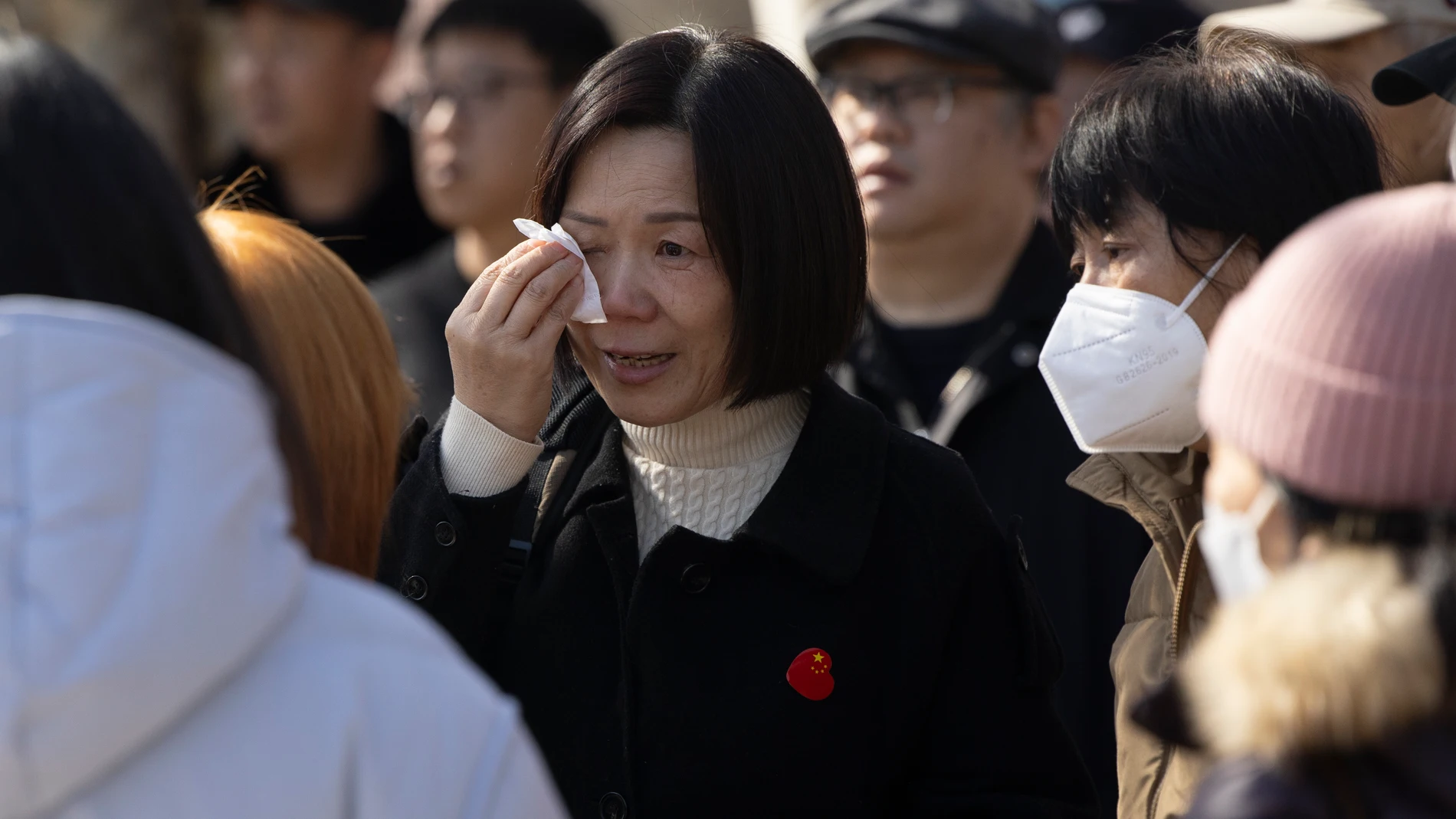 Beijing (China), 08/03/2024.- A relative of passengers of the MH370 Malaysia Airlines flight that dissapeared on 08 March 2014, dries her eyes at a gathering near the Malaysia Embassy in Beijing, China, 08 March 2024. Malaysia Airlines flight 370 disappeared over the Indian Ocean when it deviated en route from Kuala Lumpur to Beijing, on 08 March 2014. (Malasia) EFE/EPA/ANDRES MARTINEZ CASARES