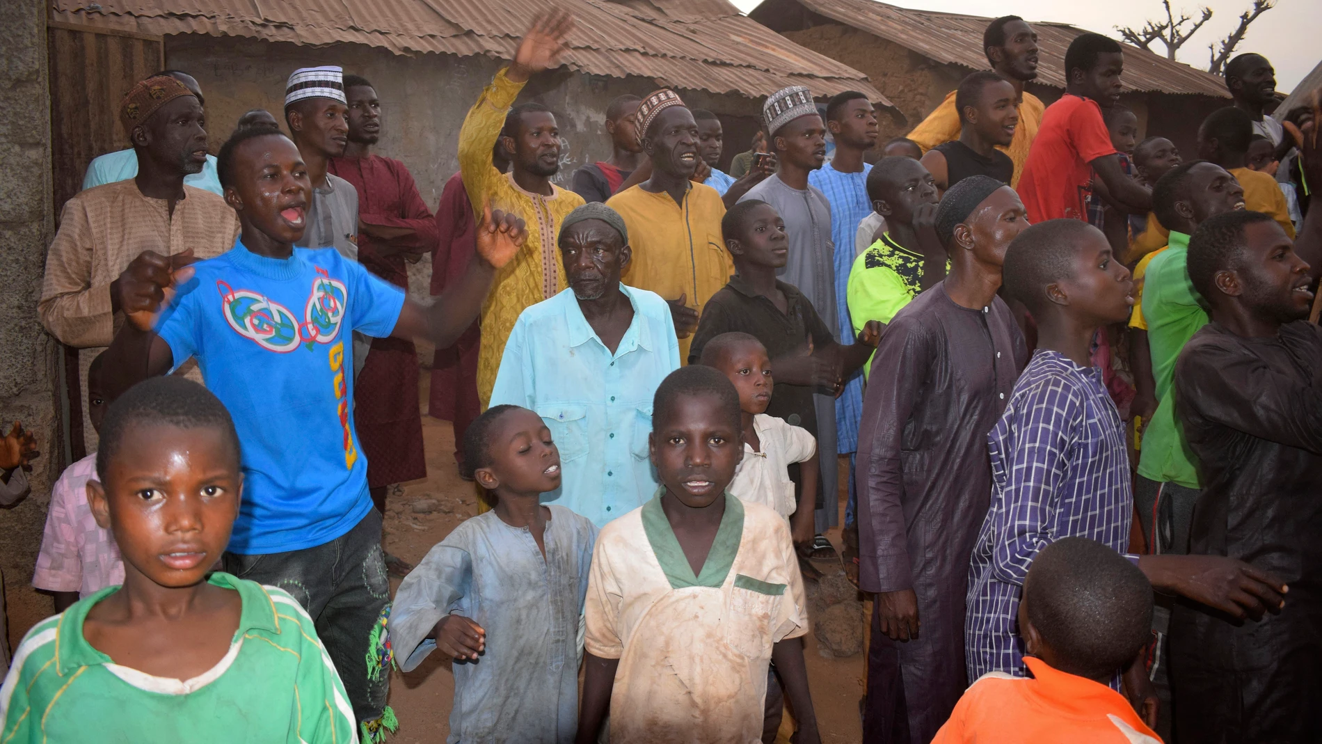 People gather around an area were gunmen kidnapped school children in Chikun, Nigeria, Thursday, March 7, 2024. Gunmen attacked a school in Nigeria's northwest region Thursday morning and abducted at least 287 students, the headteacher told authorities, marking the second mass abduction in the West African nation in less than a week. (AP Photo)