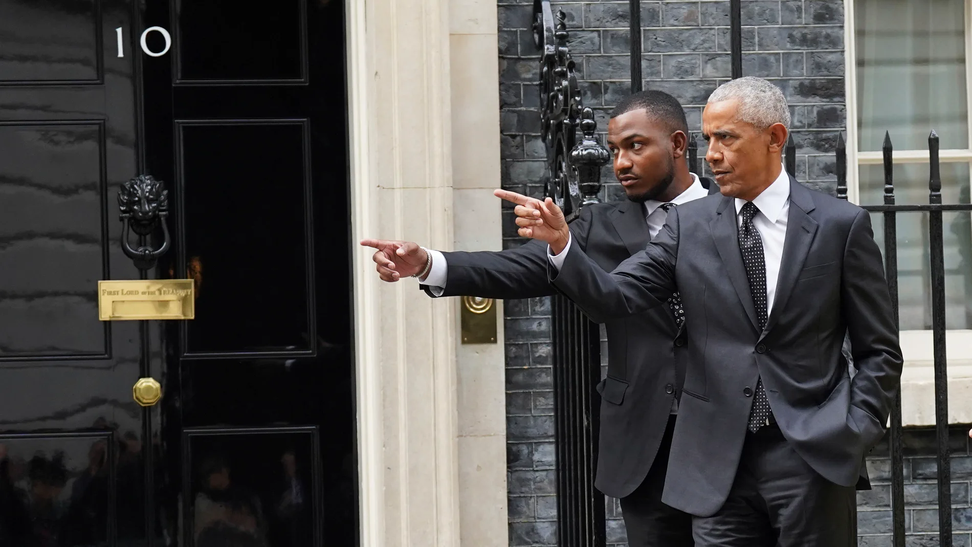 Former US president Barack Obama, right, leaves following a meeting at 10 Downing Street, London, Monday March 18, 2024. (Stefan Rousseau/PA via AP)