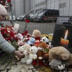 A woman mourns and brings a toy at the Crocus City Hall concert venue following a terrorist attack in Krasnogorsk, outside Moscow, Russia, 23 March 2024.