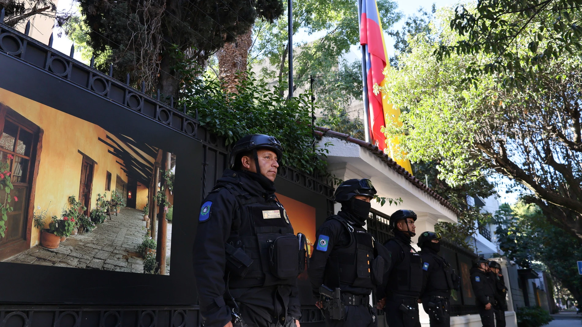 Mexican police stand guard outside the Ecuadorian Embassy, in Mexico City, Saturday, April 6, 2024. The Mexican president moved to break off diplomatic ties with Ecuador after police broke into the Mexican Embassy in Quito to arrest a former vice president who had sought political asylum there after being indicted on corruption charges. (AP Photo/Ginnette Riquelme)