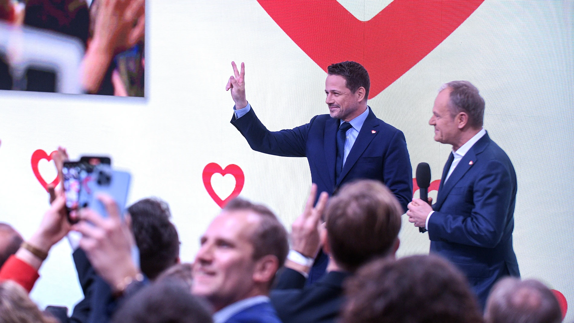 Warsaw (Poland), 07/04/2024.- Mayor of Warsaw, Rafal Trzaskowski (L-back) reacts alongside Polish Prime Minister and leader of Civic Platform (PO) party Donald Tusk (R-back) after the announcement of preliminary results of the local elections at their party's electoral headquarters in Warsaw, Poland, 07 April 2024. Law and Justice (PiS), the largest opposition party, won the most votes in elections for provincial assemblies, according to an exit poll published on 07 April evening by Ipsos. Th...