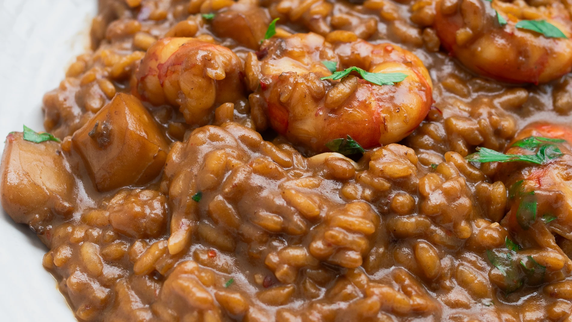 Arroz meloso con gambones al ajillo