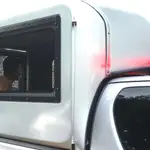 Spanish chef, Daniel Sancho Bronchalo (L), accused of murder sits inside a prisoner transportation vehicle, as arrives for a hearing on his trial at the Koh Samui Provincial Court in Koh Samui island, Thailand