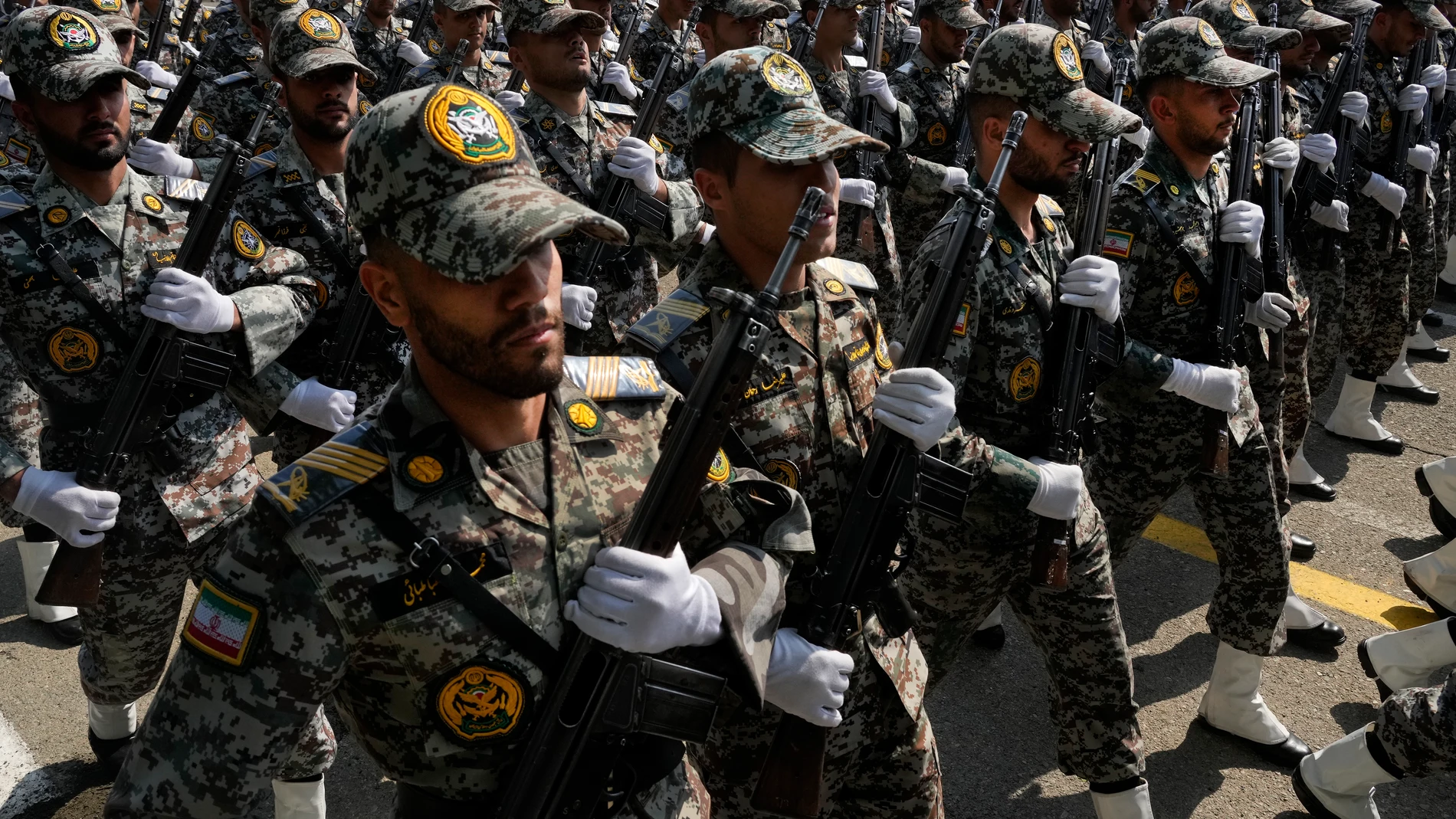 Iranian army members march during Army Day parade at a military base in northern Tehran, Iran, Wednesday, April 17, 2024. In the parade, President Ebrahim Raisi warned that the "tiniest invasion" by Israel would bring a "massive and harsh" response, as the region braces for potential Israeli retaliation after Iran's attack over the weekend. (AP Photo/Vahid Salemi)