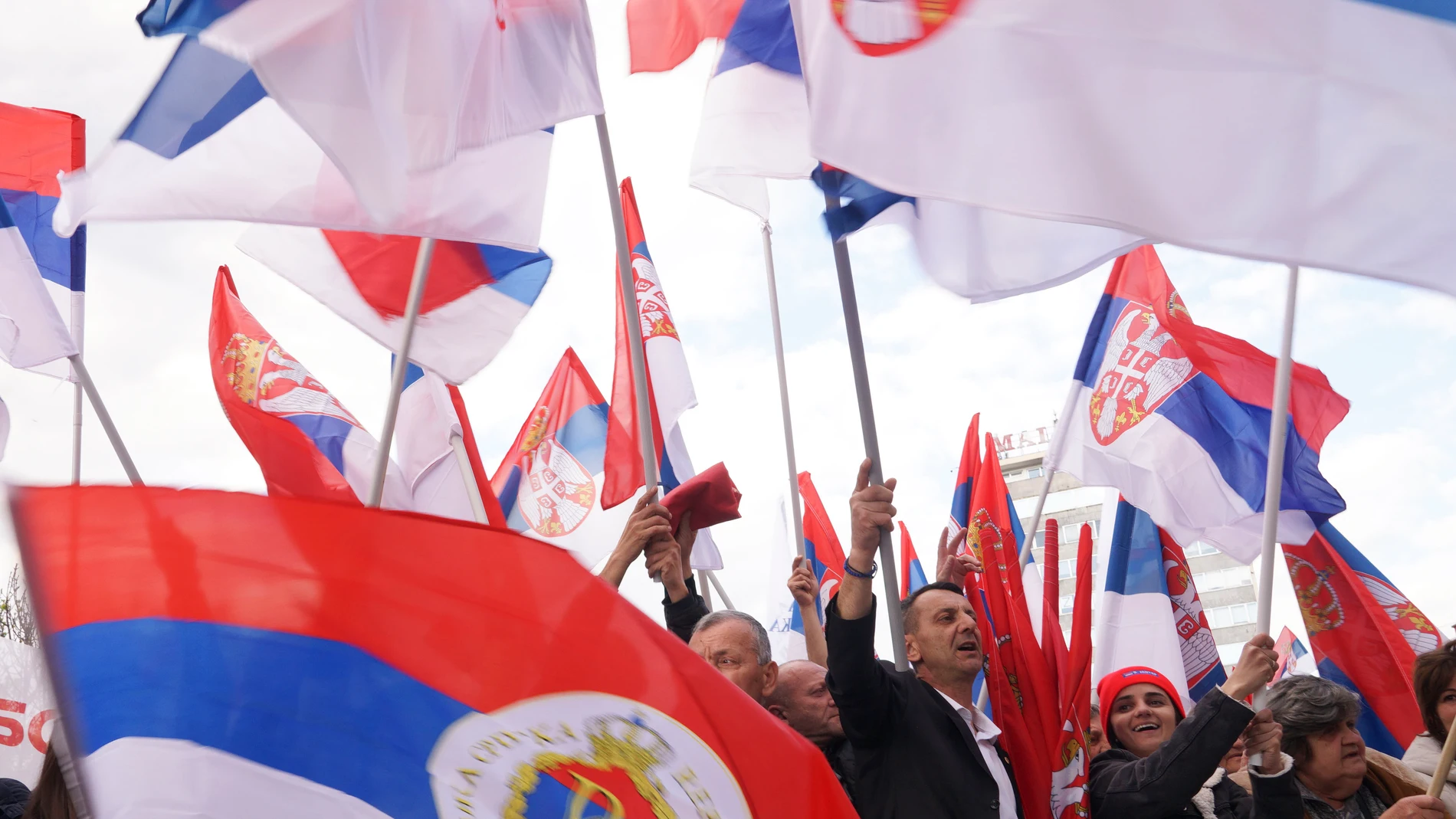 Supporters of Bosnian Serb political leader Milorad Dodik wave Serbian flags during protest against what he claims is Western aggression against Republika Srpska entity in the Bosnian town of Banja Luka, 240 kms northwest of Sarajevo, Thursday, April 18, 2024. (AP Photo/Radivoje Pavicic)