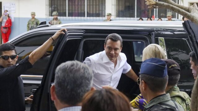 President Daniel Noboa arrives to vote in a referendum to endorse new security measures to crackdown on criminal gangs responsible for increasing violence, in Olon, Ecuador, Sunday, April 21, 2024.