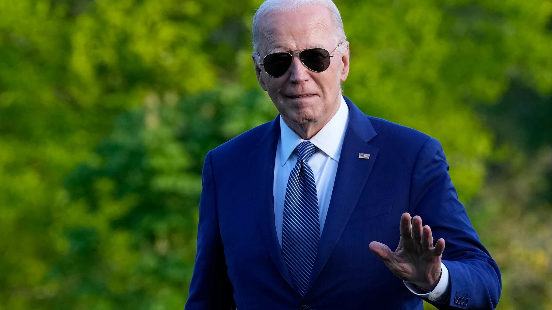 President Joe Biden waves as he walks across the South Lawn of the White House in Washington, Tuesday, April 23, 2024, after returning from a trip to Florida where he blamed Donald Trump for Florida's upcoming abortion ban. (AP Photo/Susan Walsh)