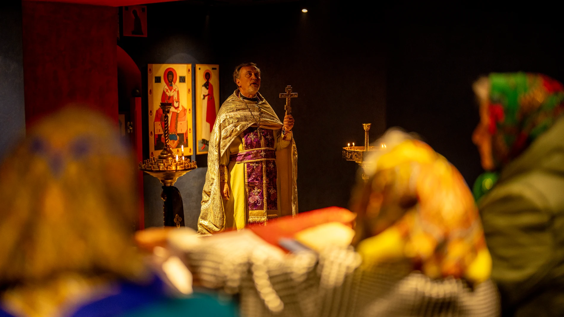 Christian Orthodox priest Hennadii Kharkivskyi leads a service at the chapel basement of the Church of the Intercession of the Blessed Virgin Mary in, Lypivka, near Lviv, Ukraine, Sunday, April 28, 2024. This Orthodox Easter season, an extraordinary new church is bringing spiritual comfort to war-weary residents of the Ukrainian village of Lypivka. Two years ago it also provided physical refuge from horrors outside. (AP Photo/Francisco Seco)