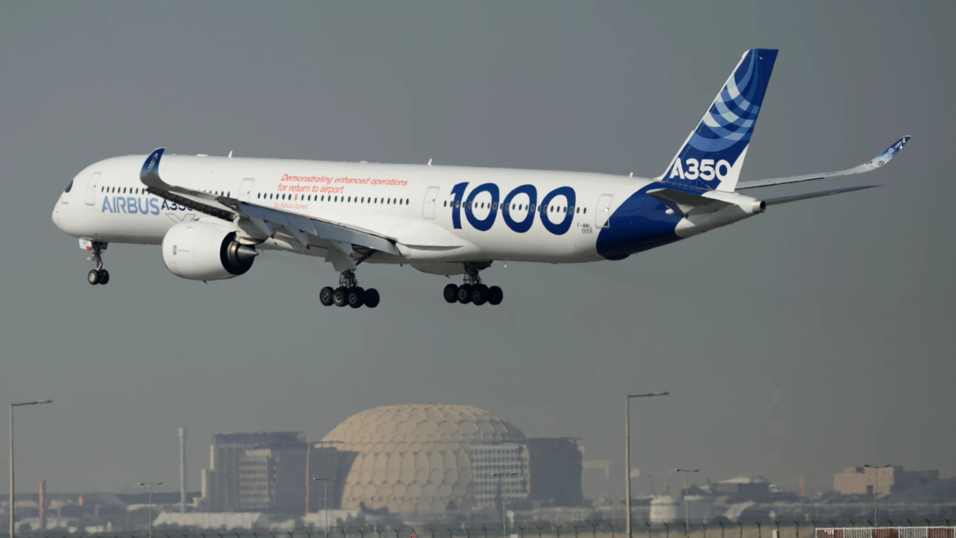 FILE - An Airbus A350 prepares to land at the Dubai Air Show, United Arab Emirates, Nov. 14, 2023. In the latest round of their decades-long battle for dominance in commercial aircraft, Europe's Airbus has established a clear sales lead over Boeing as the American company deals with the fallout from manufacturing troubles and ongoing safety concerns. (AP Photo/Kamran Jebreili, File)