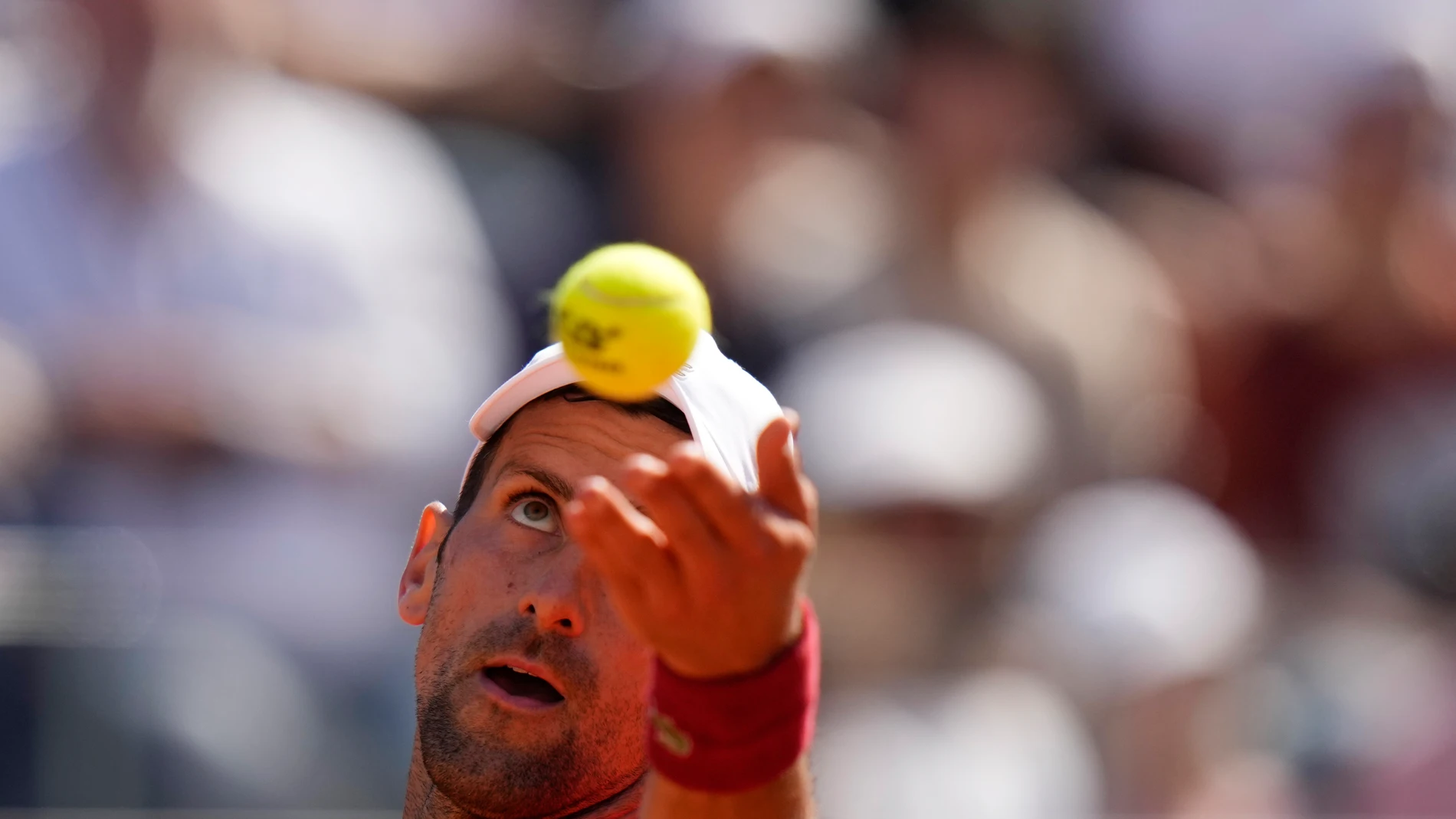 Serbia's Novak Djokovic serves the ball to Chile's Alejandro Tabilo at the Italian Open tennis tournament in Rome, Sunday, May 12, 2024. (AP Photo/Alessandra Tarantino)