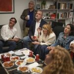 Socialist candidate Salvador Illa, left, watches early results on TV with other members of the PSC ( Socialist Party of Catalonia ) at the party headquarters in Barcelona, Sunday May 12, 2024. 