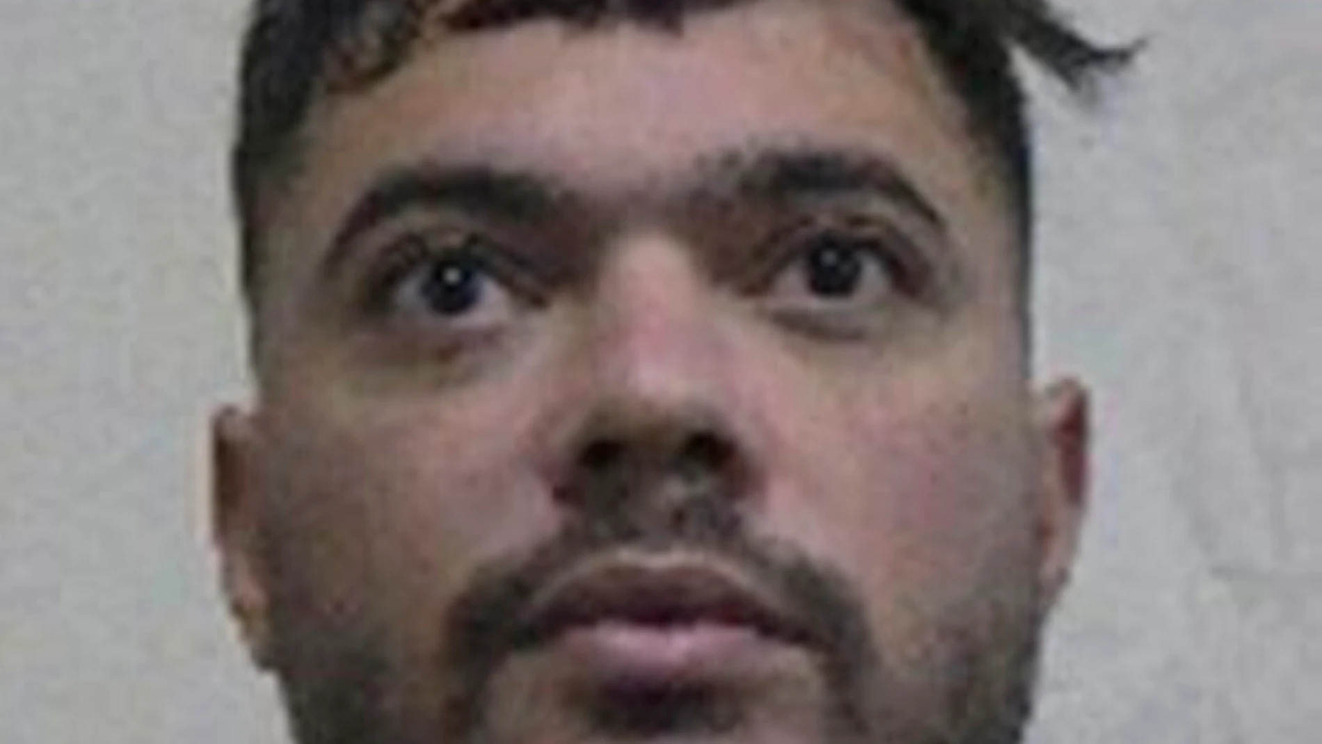 This picture provided by Interpol shows Mohamed Amra, a convict that escaped from prison on Tuesday. May 14, 2024. A massive manhunt is underway in France on Wednesday, May 15, 2024, for an armed gang that ambushed a prison convoy, killing two prison officers, seriously injuring three others and springing the inmate they were escorting. (Interpol via AP)