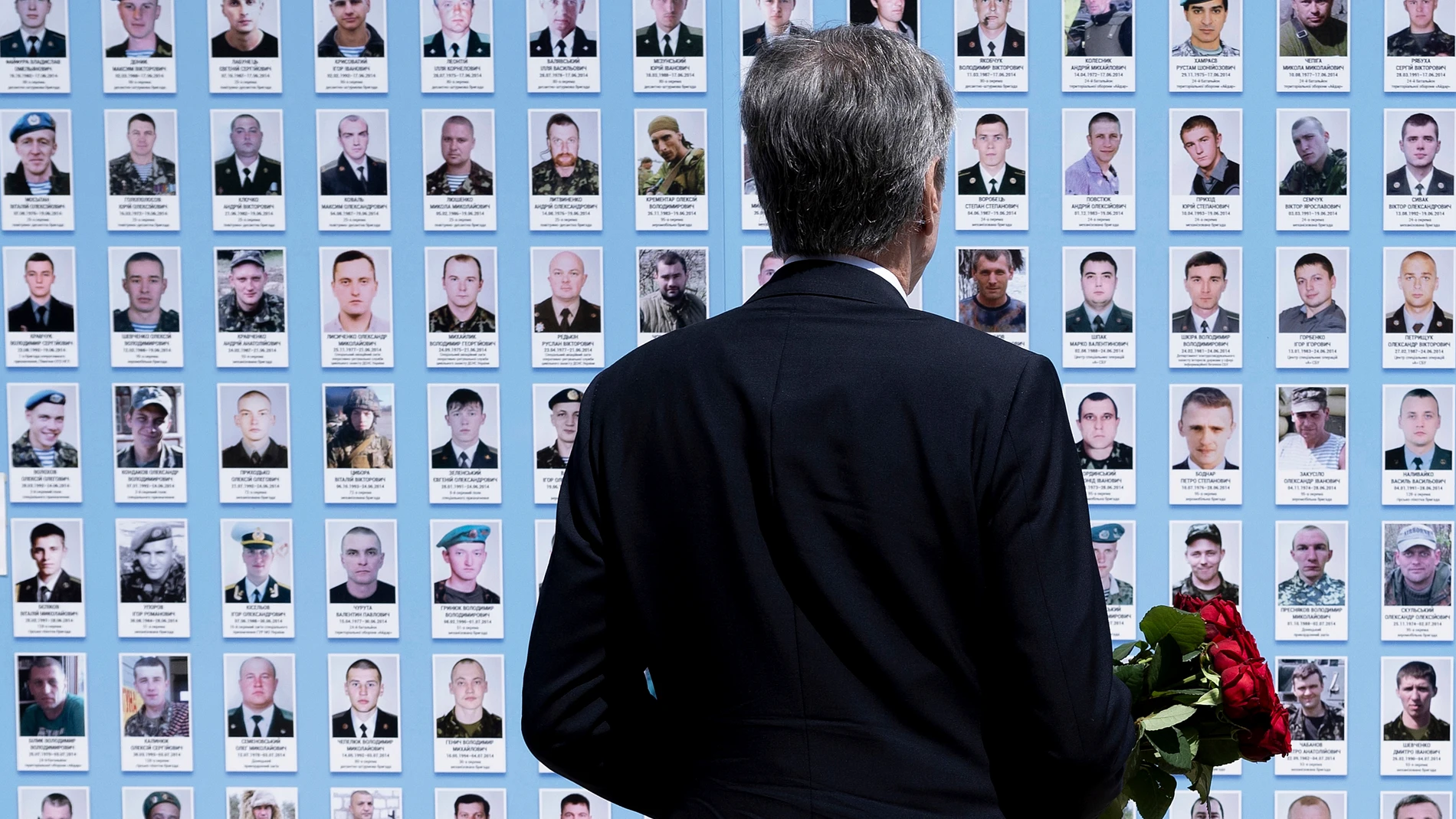 US Secretary of State Antony Blinken lays flowers at the Memory Wall of Fallen Defenders of Ukraine outside the Saint Michael's Golden Domed Monastery in Kyiv on Wednesday, May 15, 2024. (Brendan Smialowski/Pool Photo via AP)