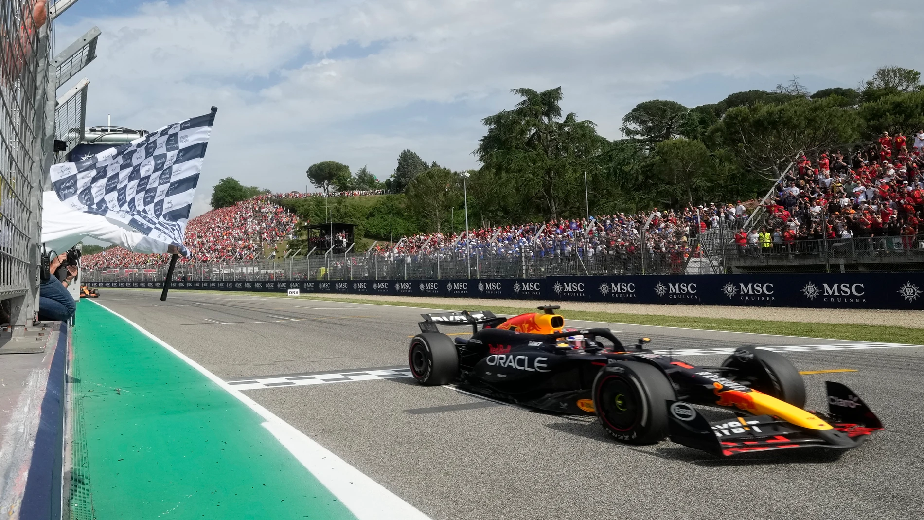 Red Bull driver Max Verstappen of the Netherlands crosses the finish line to win the Italy's Emilia Romagna Formula One Grand Prix race at the Dino and Enzo Ferrari racetrack in Imola, Italy, Sunday, May 19, 2024. (AP Photo/Luca Bruno, Pool)