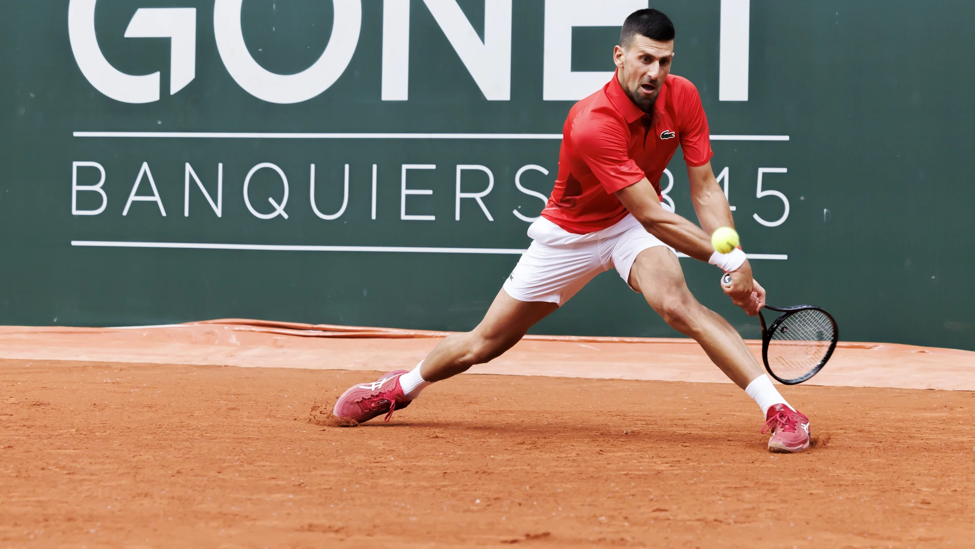 Geneva (Switzerland), 22/05/2024.- Novak Djokovic, of Serbia, returns a ball to Yannick Hanfmann, of Germany, during the men's singles second round of the ATP 250 Geneva Open tournament in Geneva, Switzerland, 22 May 2024. (Tenis, Alemania, Suiza, Ginebra) EFE/EPA/SALVATORE DI NOLFI