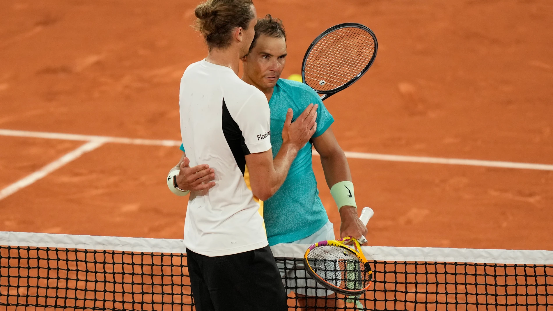Germany's Alexander Zverev, left, kisses Spain's Rafael Nadal after winning the game during their first round match of the French Open tennis tournament at the Roland Garros stadium in Paris, Monday, May 27, 2024. (AP Photo/Thibault Camus)
