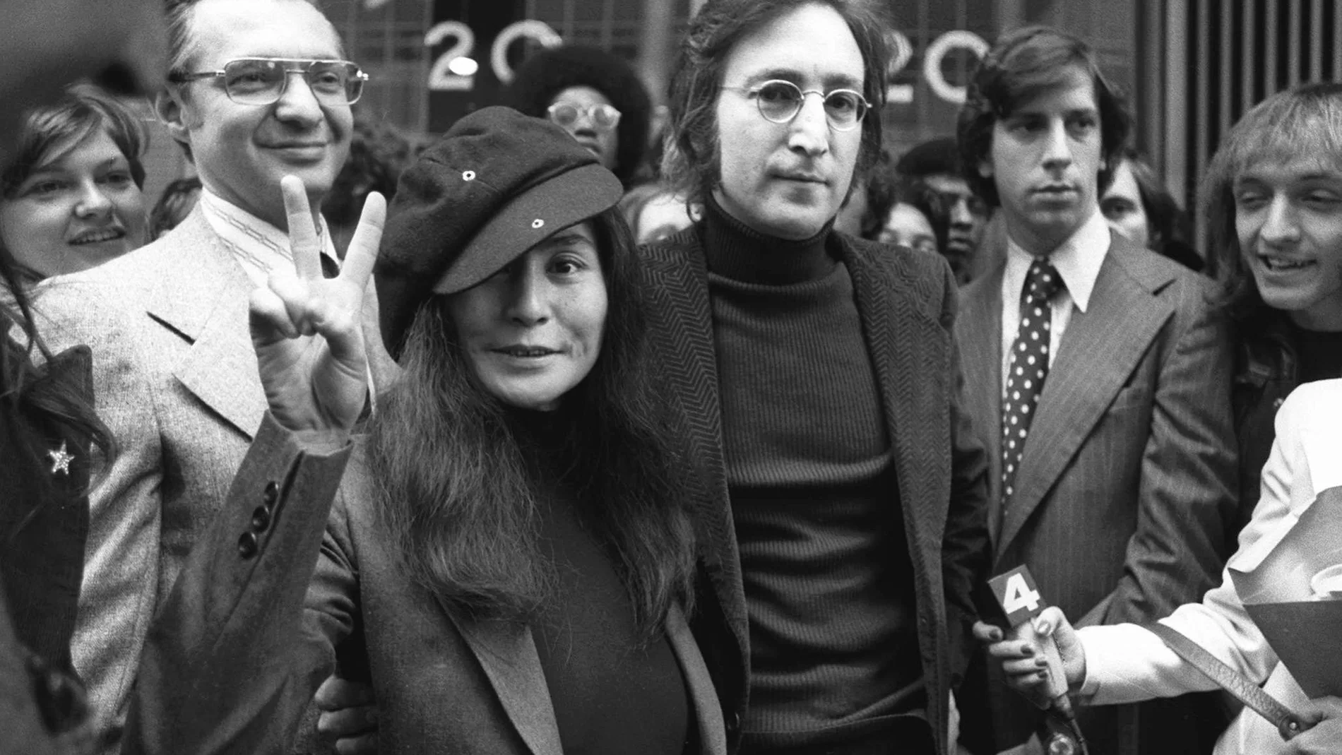In this April 18, 1972, file photo, John Lennon and his wife, Yoko Ono, leave a U.S. Immigration hearing in New York City.