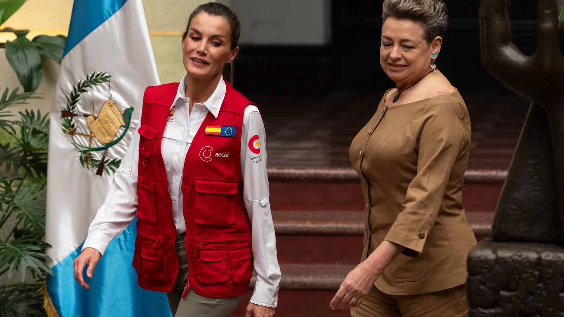 Spain's Queen Letizia, left, walks with Guatemalan first lady Lucrecia Peinado as she arrives at the National Palace as part of a three-day, official visit in Guatemala City, Wednesday, June 5, 2024. (AP Photo/Moises Castillo)