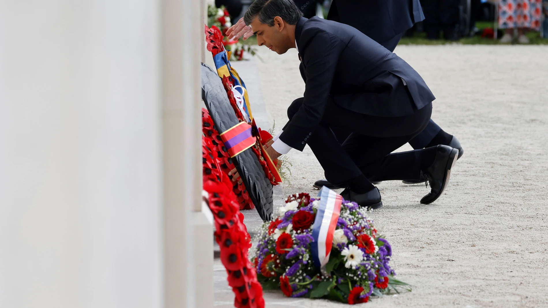 Britain's Prime Minister Rishi Sunak lays a wreath during a commemorative ceremony marking the 80th anniversary of the World War II D-Day" Allied landings in Normandy, at the World War II British Normandy Memorial of Ver-sur-Mer, Thursday, June 6, 2024. Normandy is hosting various events to officially commemorate the 80th anniversary of the D-Day landings that took place on June 6, 1944. (Ludovic Marin/Pool via AP)