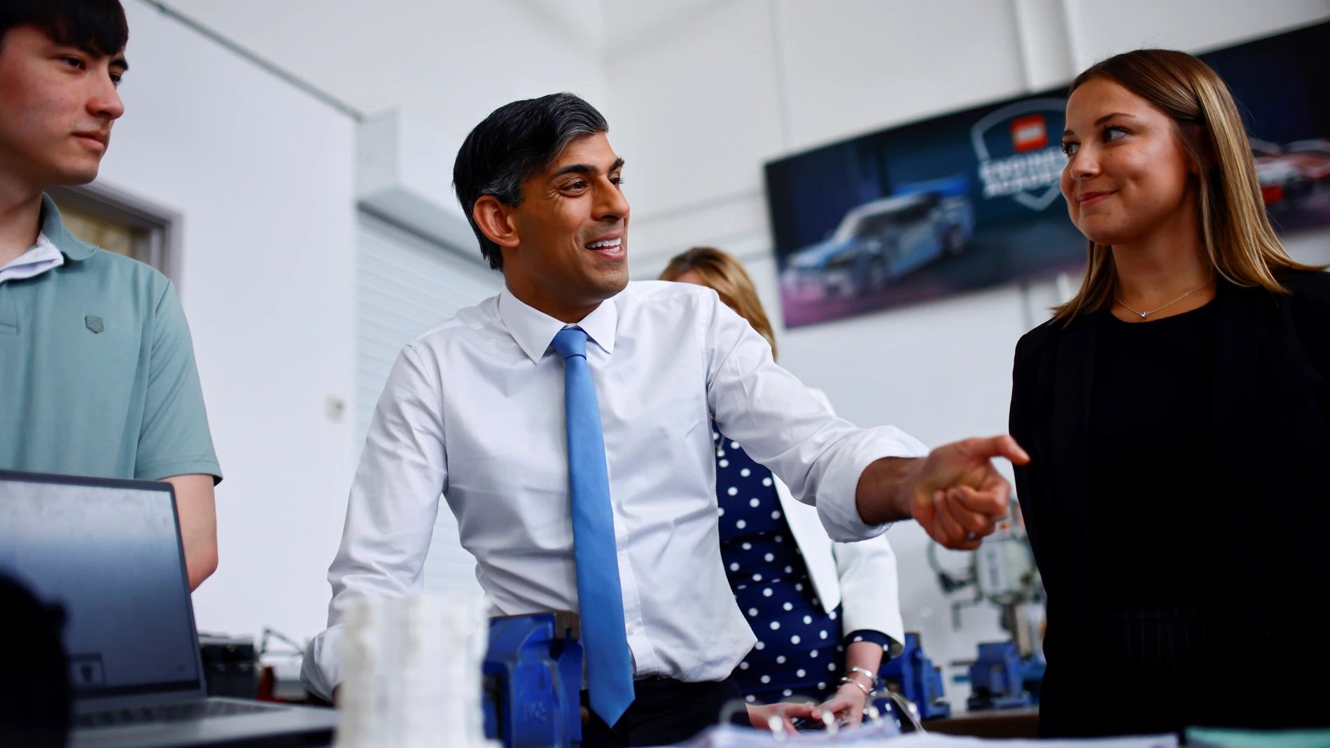 Britain's Prime Minister and Conservative Party leader Rishi Sunak speaks with students during a visit of University Technical College (UTC) in Silverstone, England, Tuesday June 11, 2024, in the build-up to the UK general election on July 4. (Benjamin Cremel, Pool Photo via AP)