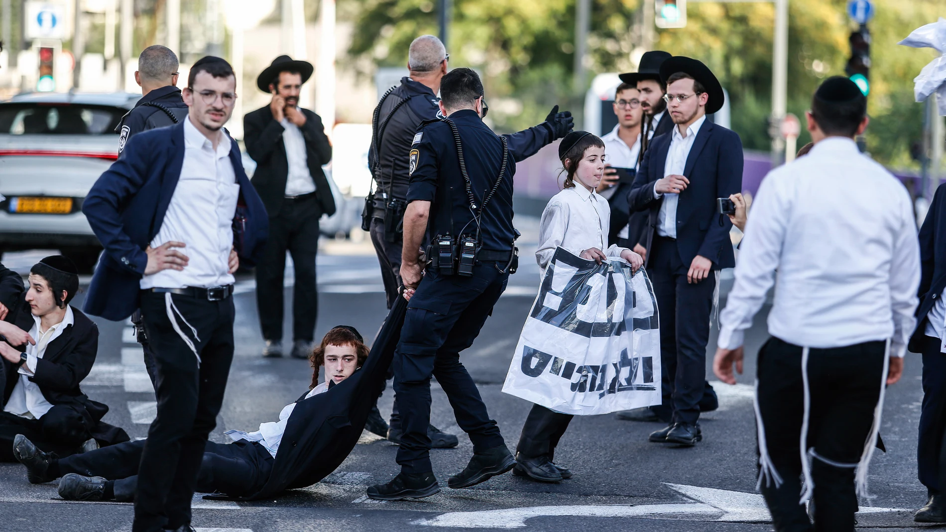 June 2, 2024, Jerusalem, Israel: Police officers remove ultra-Orthodox Jews blocking the road during a protest against military conscription outside the Israeli Supreme Court. Israel's Supreme Court hears on 02 June a response by the state over the ultra orthodox recruitment issue, after previously extending a deadline for the government to present a conscription plan for ultra-Orthodox Jews, who are traditionally exempt from military service. 02/06/2024
