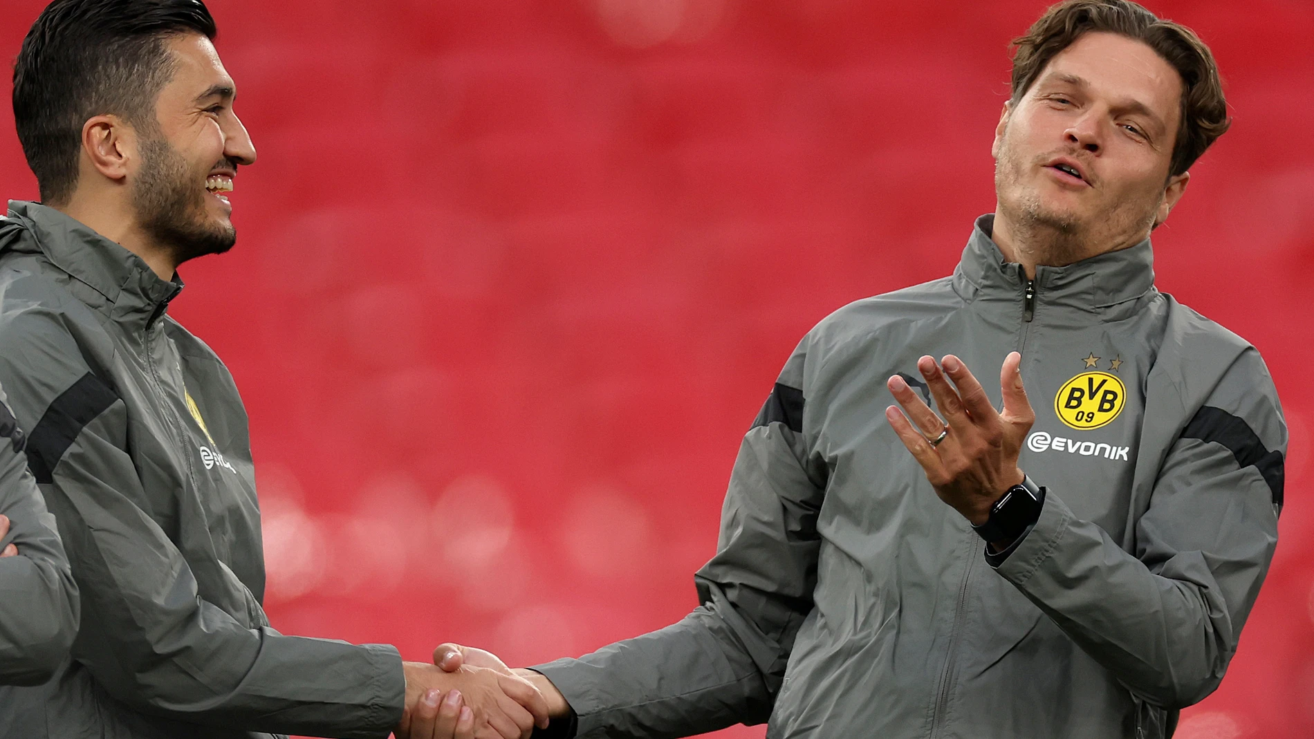 FILE - Dortmund's head coach Edin Terzic, right, and assistant coach Nuri Sahin shake hands during a training session ahead of the Champions League final soccer match between Borussia Dortmund and Real Madrid at Wembley Stadium in London, on May 31, 2024. Borussia Dortmund appointed former player Nuri Sahin as coach on Friday June 14, 2024 to replace Edin Terzić, who quit the club the day before. (AP Photo/Ian Walton, File)