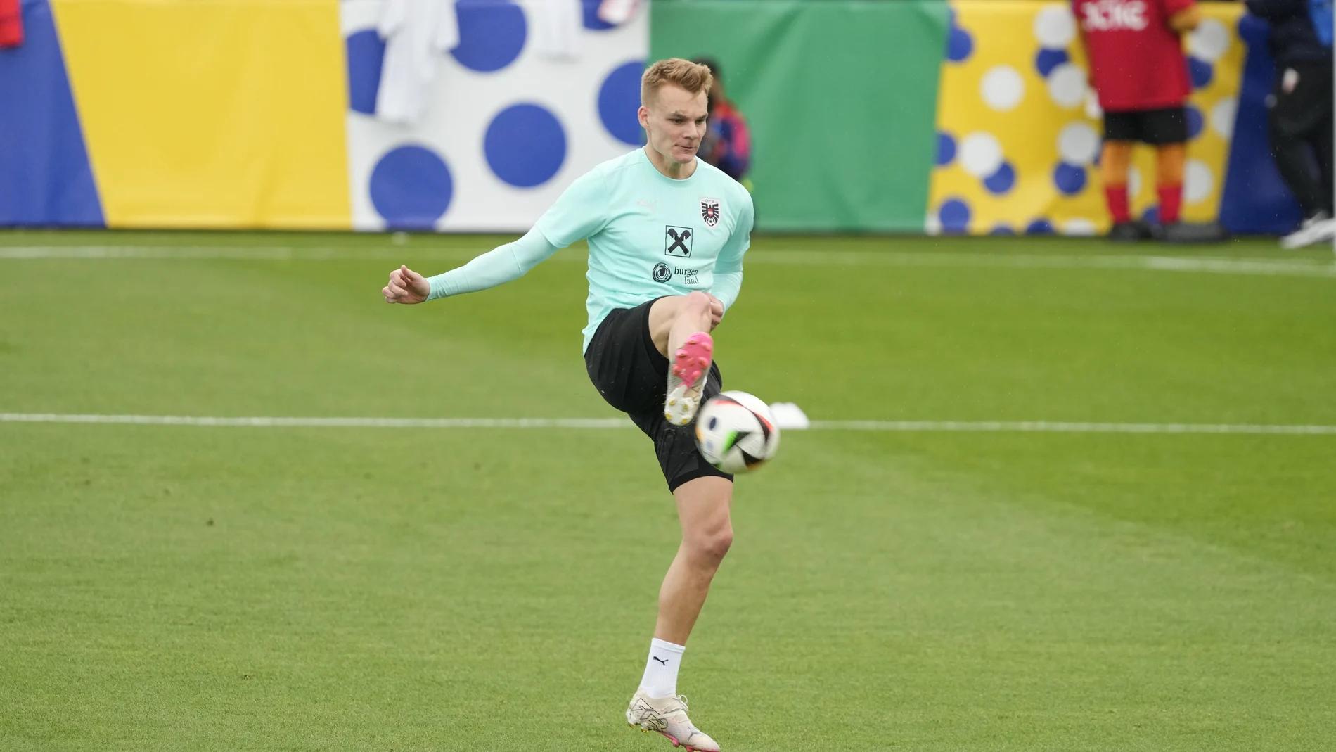 Austria's Philipp Lienhart controls the ball during a public training session in Berlin.