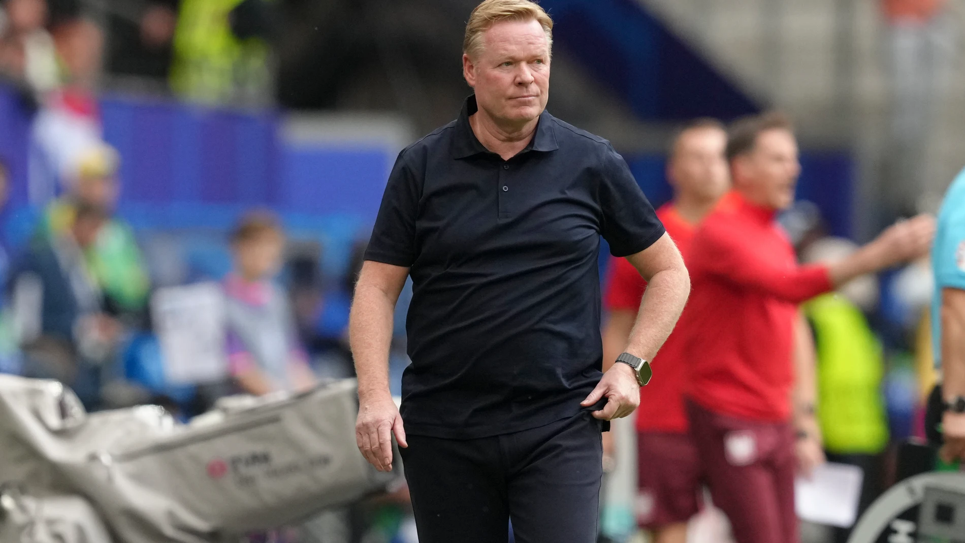 Netherlands' head coach Ronald Koeman walks at the sideline during a Group D match between Poland and the Netherlands at the Euro 2024 soccer tournament in Hamburg, Germany, Sunday, June 16, 2024. (AP Photo/Sunday Alamba)