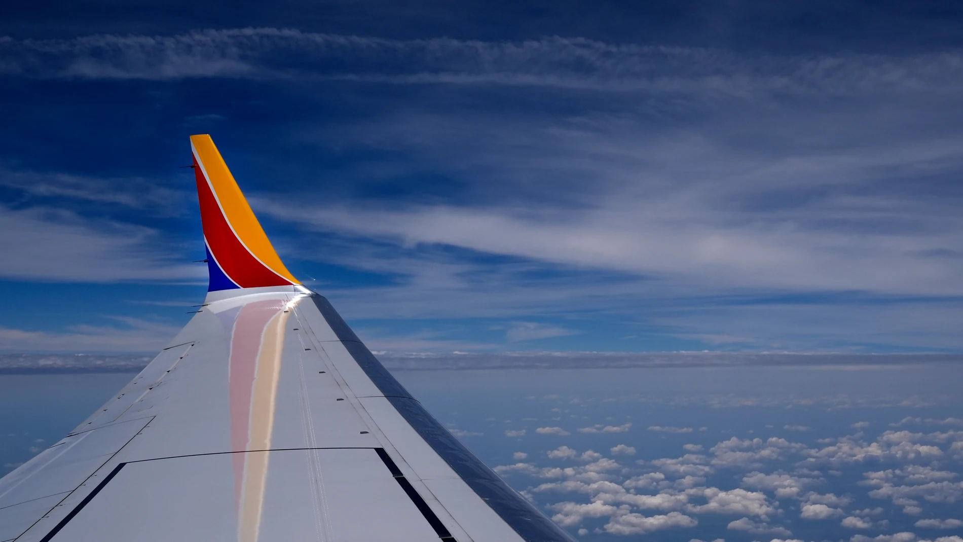 A Southwest Airlines Boeing 737 Max 8 passenger jet flies over the central United States heading for Chicago's Midway International Airport from Tulsa, Okla., Saturday, June 15, 2024, in Tulsa. (AP Photo/Charles Rex Arbogast)