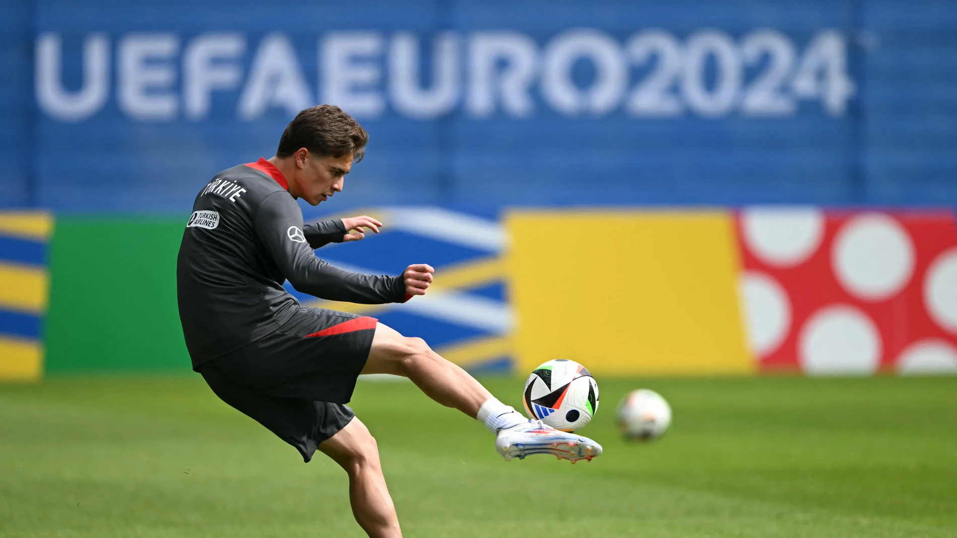 Turkey's forward #19 Kenan Yildiz kicks the ball during a training session of Turkey's national football team ahead of the UEFA Euro 2024 football Championship at the team's base camp in Barsinghausen.