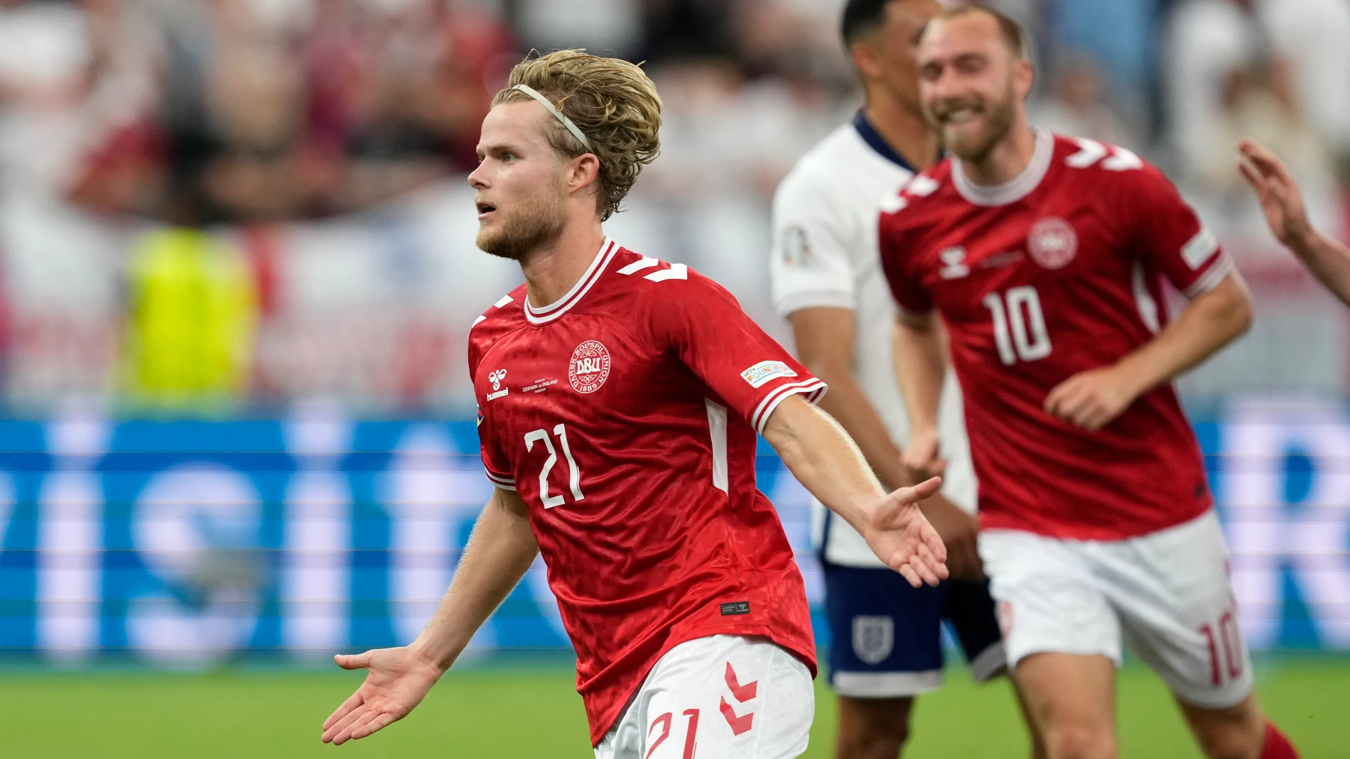 Denmark's Morten Hjulmand runs to celebrate after scoring his sides first goal during a Group C match between Denmark and England at the Euro 2024 soccer tournament in Frankfurt, Germany, Thursday, June 20, 2024. (AP Photo/Michael Probst)