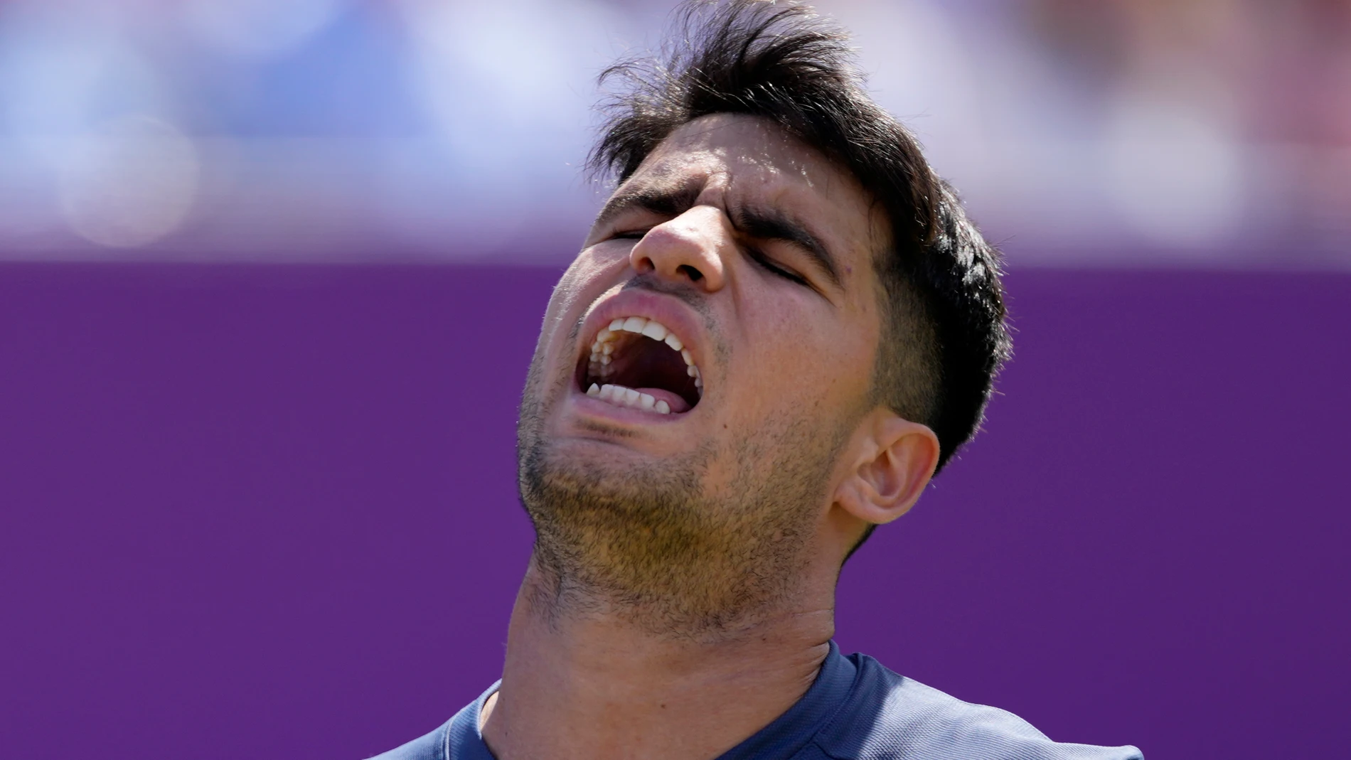 Carlos Alcaraz of Spain reacts after losing a point against Jack Draper of Britain during their men's singles match on day six of The Queen's Club tennis tournament, in London, Thursday, June 20, 2024. (AP Photo/Kirsty Wigglesworth)