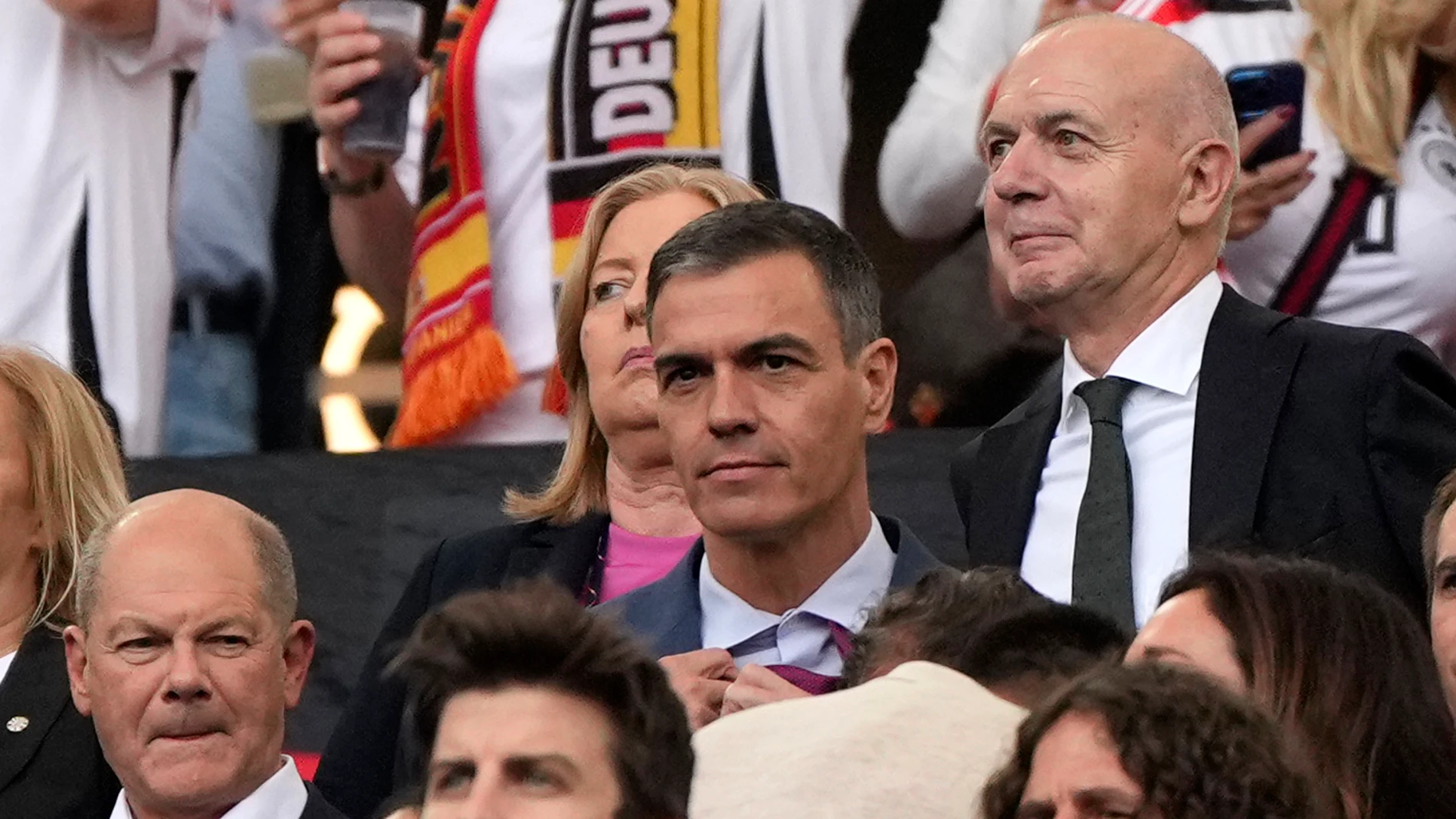 Spain's Prime Minister Pedro Sanchez, center, sits on the stands during a quarter final match between Germany and Spain at the Euro 2024 soccer tournament in Stuttgart, Germany, Friday, July 5, 2024. (AP Photo/Matthias Schrader)