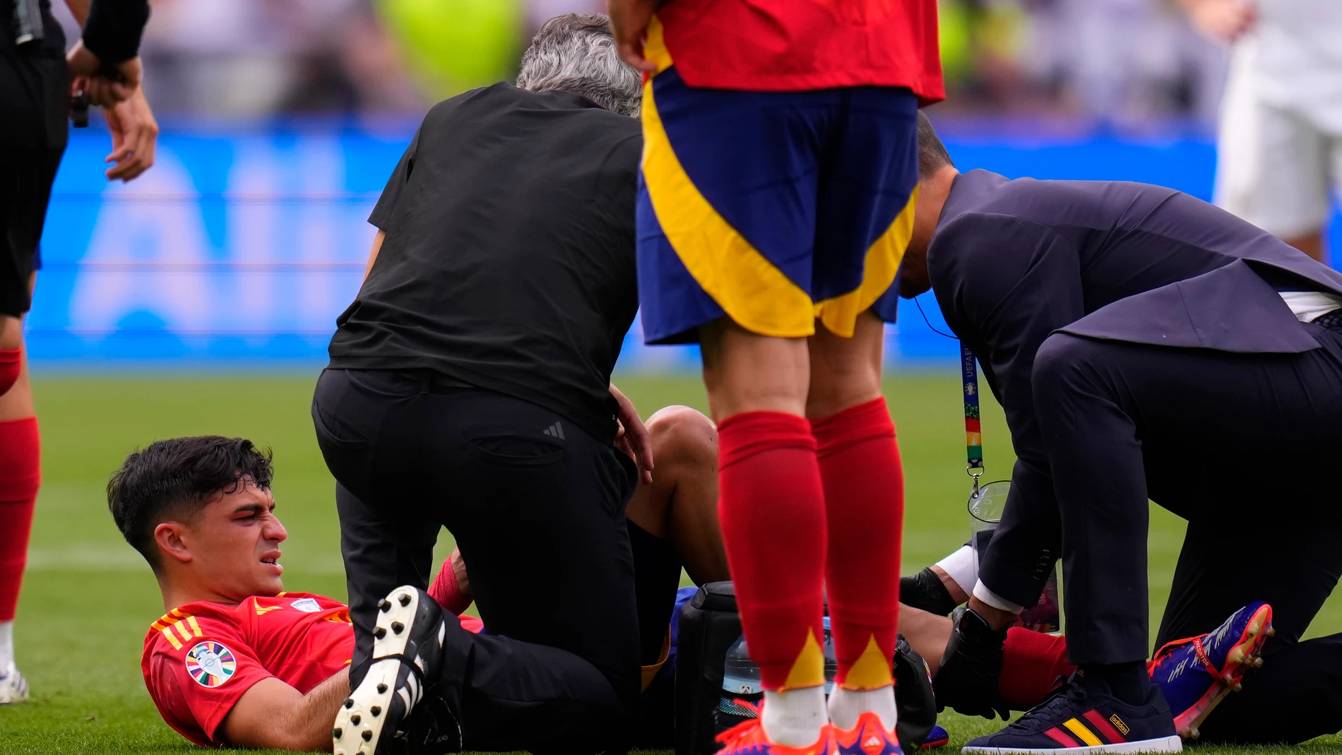 Spain's Pedri is treated after suffering an injury during a quarter final match between Germany and Spain at the Euro 2024 soccer tournament in Stuttgart, Germany, Friday, July 5, 2024. (AP Photo/Manu Fernandez)