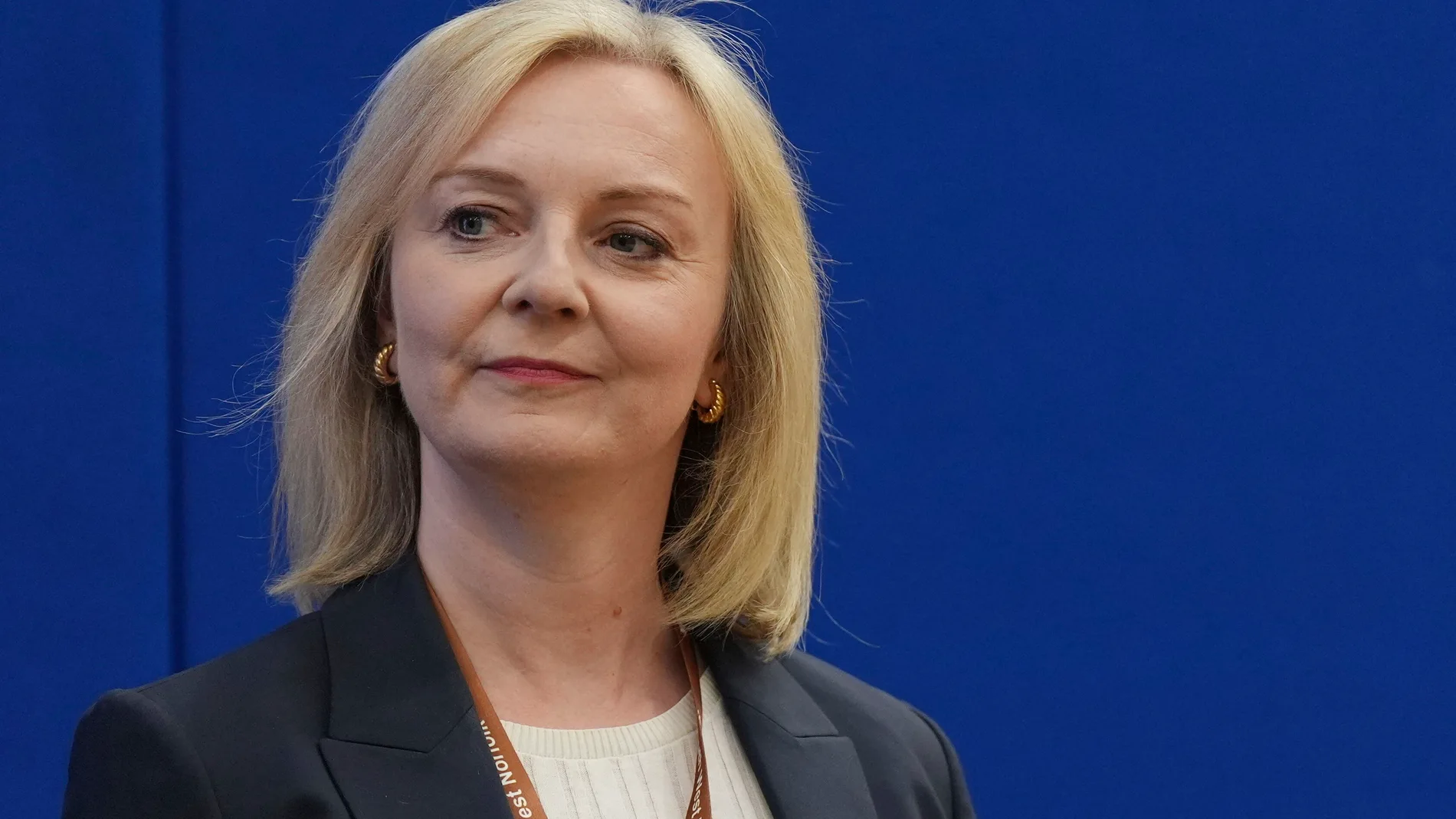 Former prime minister Liz Truss looks on as she loses her Norfolk South West seat to Labour at Alive Lynnsport in King's Lynn, Norfolk, during the count in the 2024 General Election, Friday July 5, 2024. Britain’s Labour Party swept to power Friday after more than a decade in opposition, as a jaded electorate handed the party a landslide victory — but also a mammoth task of reinvigorating a stagnant economy and dispirited nation. (Jacob King/PA via AP)
