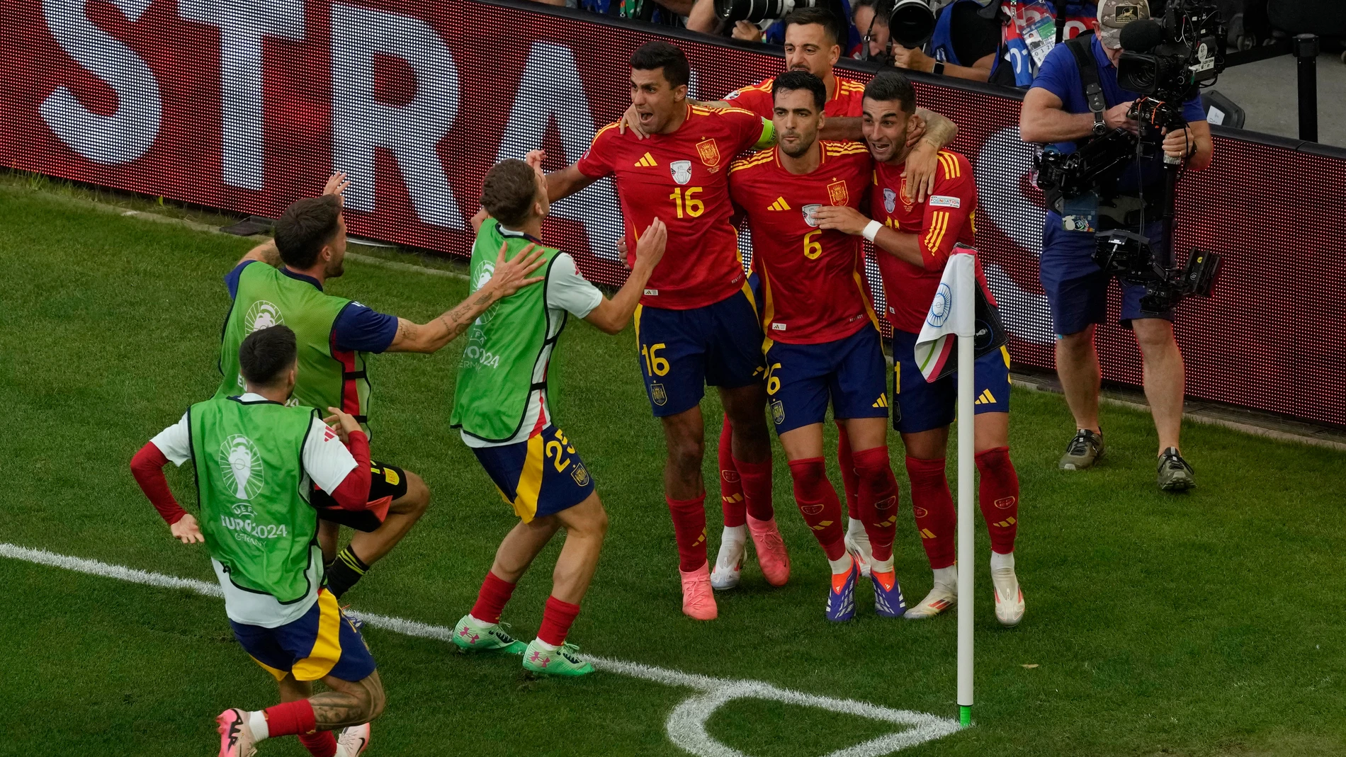 Spain's Mikel Merino, centre right celebrates with team mates after scoring his side's second goal during a quarter final match between Germany and Spain at the Euro 2024 soccer tournament in Stuttgart, Germany, Friday, July 5, 2024. (AP Photo/Michael Probst)