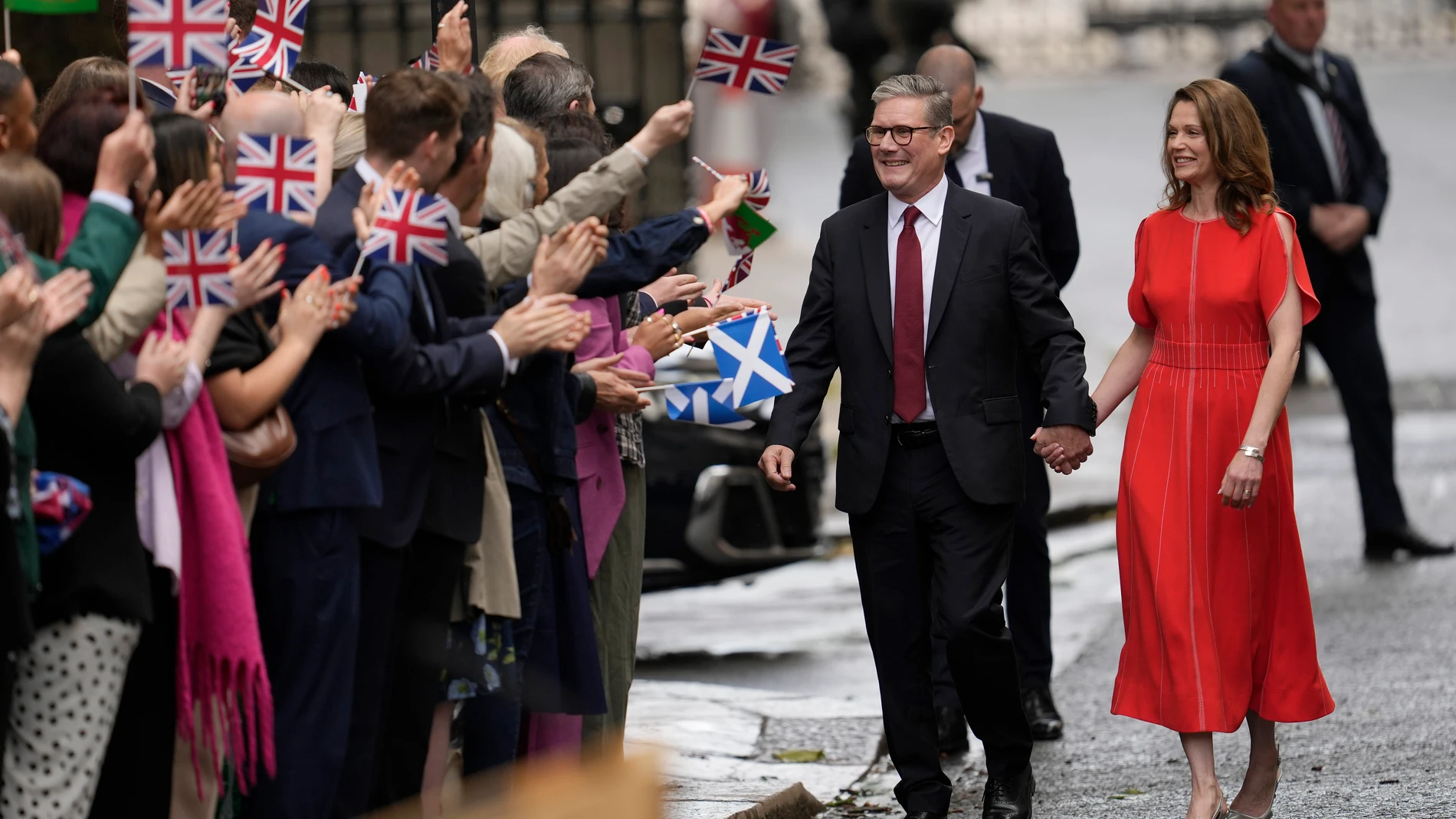Britain's Labour Party Prime Minister Keir Starmer and his wife Victoria arrive in Downing Street and greet supporters in London, Friday, July 5, 2024. Labour leader Stammer won the general election on July 4, and was appointed Prime Minster by King Charles III at Buckingham Palace, after the party won a landslide victory. (AP Photo/Vadim Ghirda)