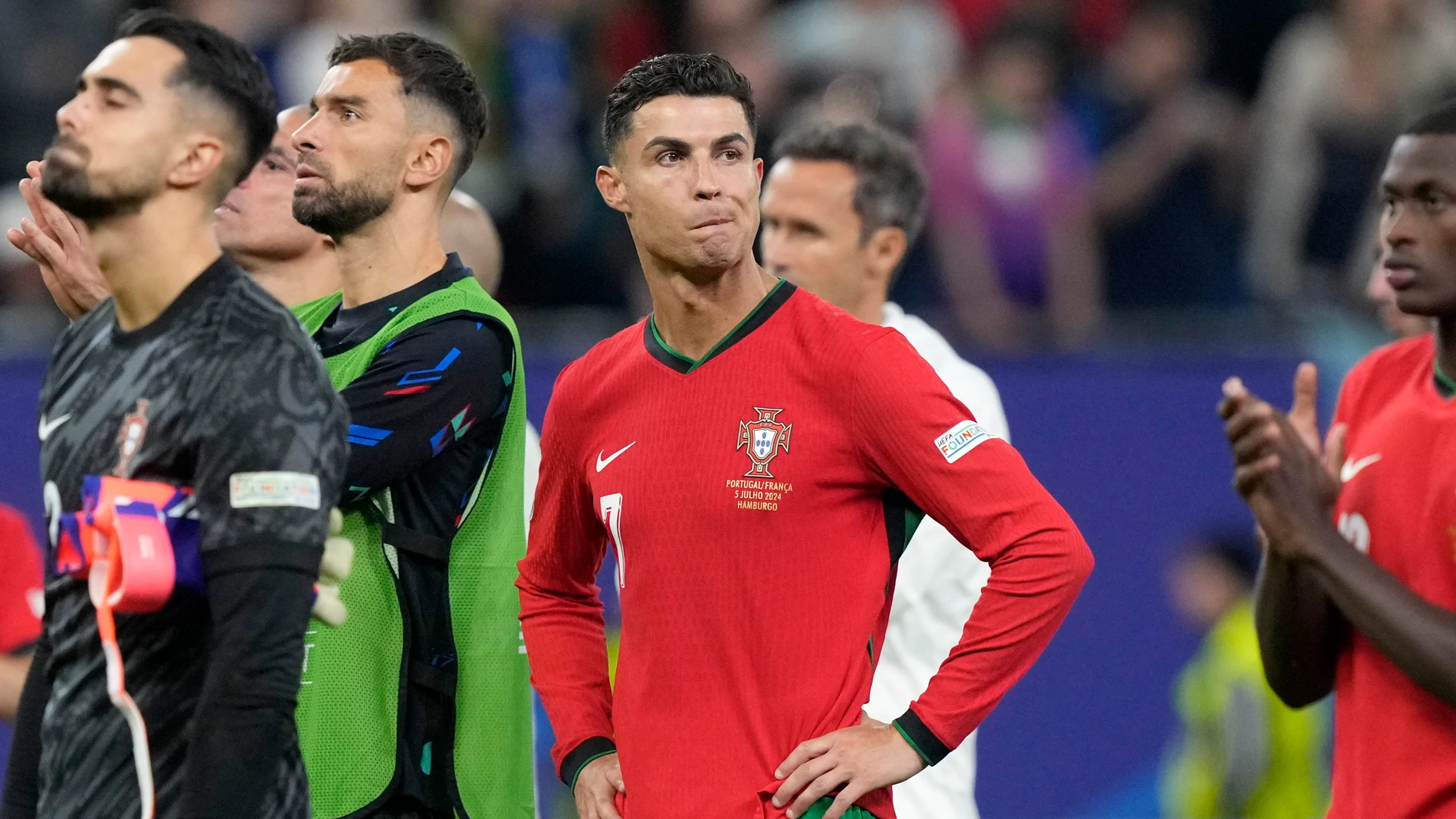 Portugal's Cristiano Ronaldo reacts after losing a quarter final match between Portugal and France at the Euro 2024 soccer tournament in Hamburg, Germany, Friday, July 5, 2024. France won a penalty shoot out 4-3 after the match ended in a 0-0 draw. (AP Photo/Martin Meissner)
