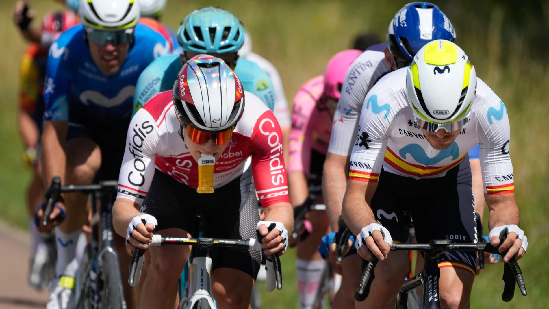 France's Axel Zingle, left, eats, as he sets the pace for the breakaway with Spain's Alex Aranburu, right, during the ninth stage of the Tour de France cycling race over 199 kilometers (123.7 miles) with start and finish in Troyes, France, Sunday, July 7, 2024. (AP Photo/Jerome Delay)