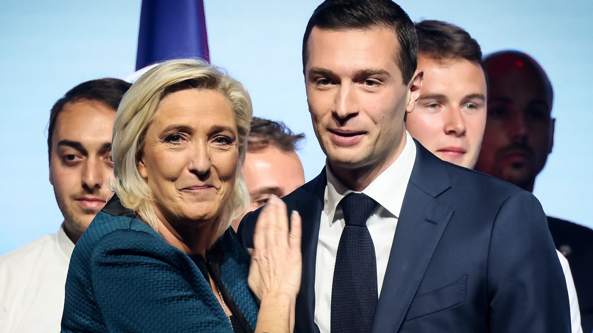 FILE - Leader of the French far-right National Rally Marine Le Pen, left, and lead candidate of the party for the upcoming European election Jordan Bardella during a political meeting on June 2, 2024 in Paris. Jordan Bardella, Le Pen's 28-year-old protégé who she'd been hoping to install as prime minister, grumbled that "the alliance of dishonor" between the National Rally's rivals kept it from power. (AP Photo/Thomas Padilla, File)