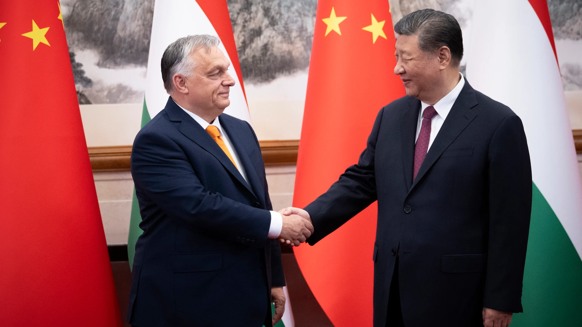 In this picture issued by the Hungarian Prime Minister's Press Office, Hungarian Prime Minister Viktor Orban, left, and Chinese President Xi Jinping shake hands before a meeting in Beijing, China, Monday, July 8, 2024. (Vivien Cher Benko/Hungarian PM's Press Office//MTI via AP)